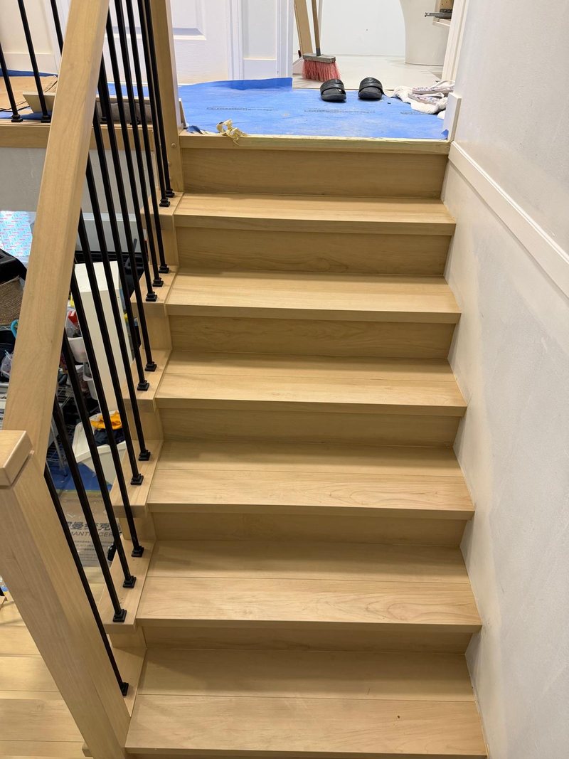 Finished staircase with light oak treads and risers in a Surrey home, by Craftbuild