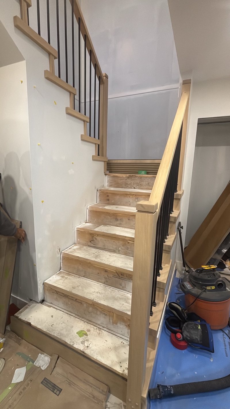 Stair treads and risers going in on the lower flight, Surrey home