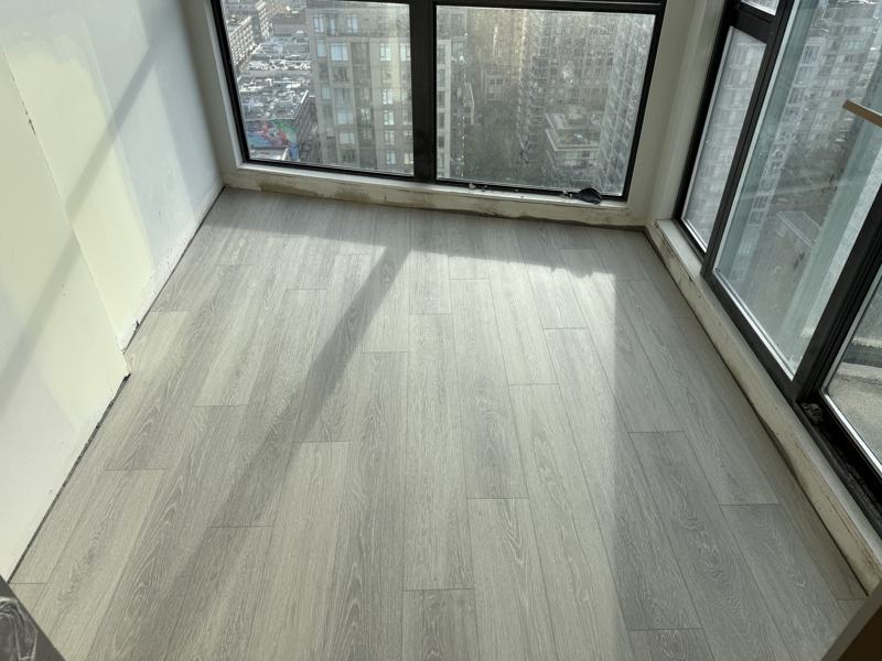 Waterproof SPC plank flooring installed by Craftbuild in a Downtown Vancouver condo
