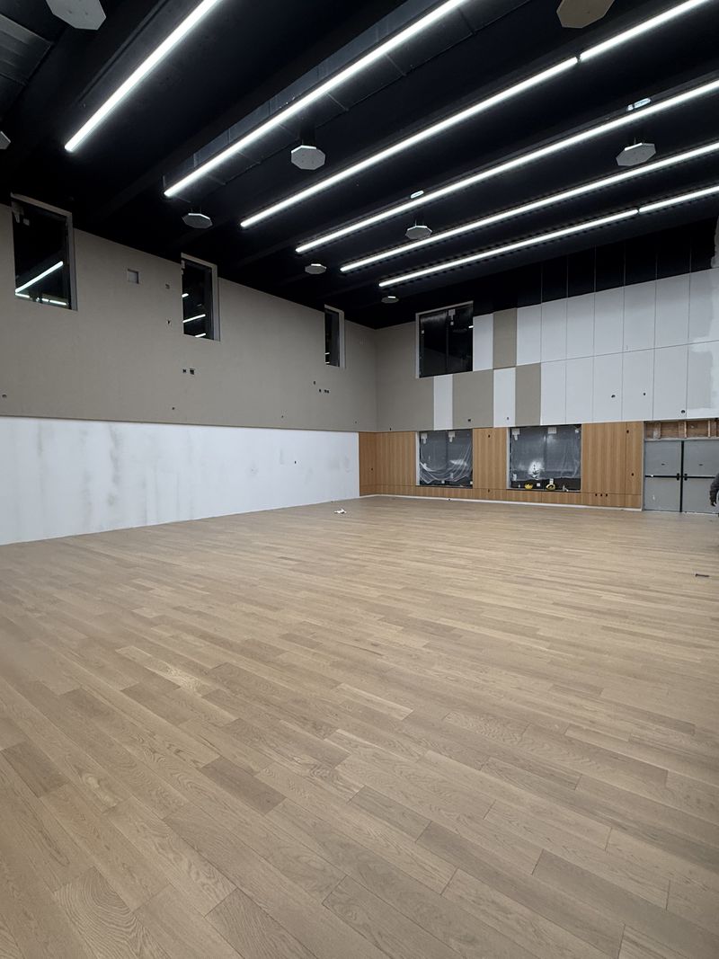 Engineered hardwood glued down by Craftbuild at &Eacute;cole La Vall&eacute;e, Pemberton