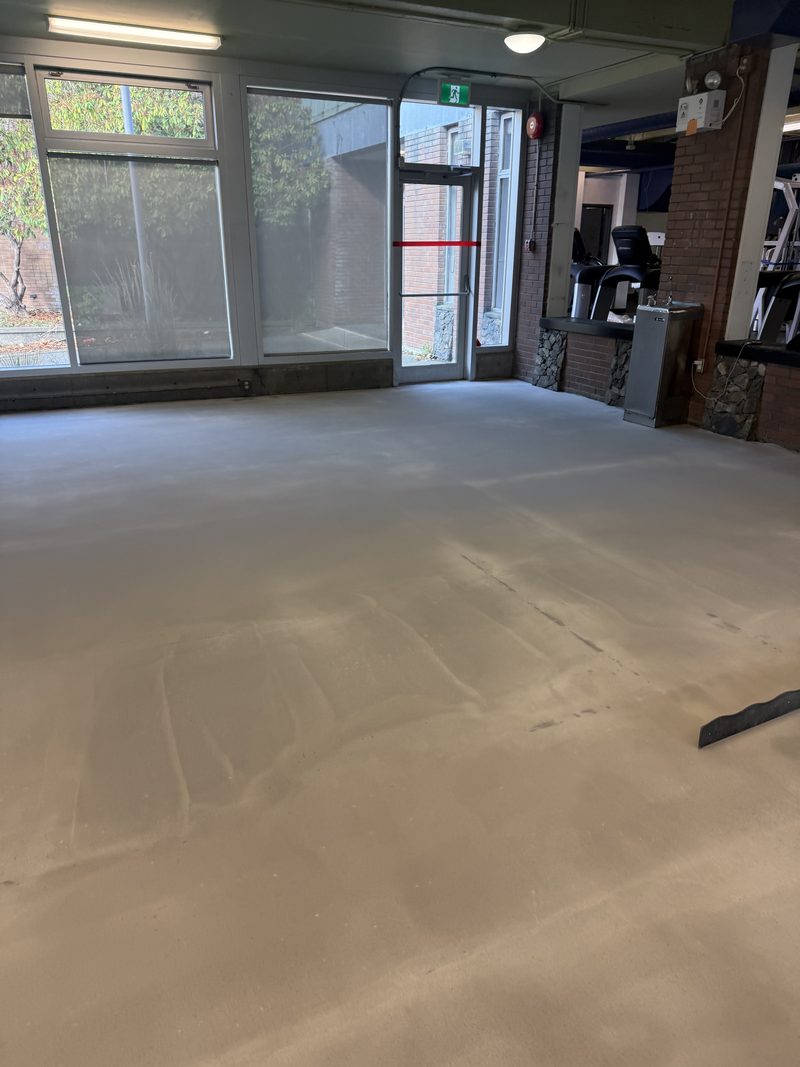 Bare concrete in a fitness centre before rubber flooring, Victoria